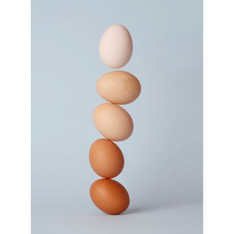 Easter eggs piling up on top of another balanced